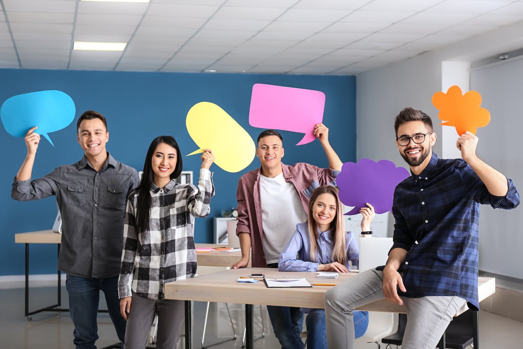 Young People with Blank Speech Bubbles Indoors